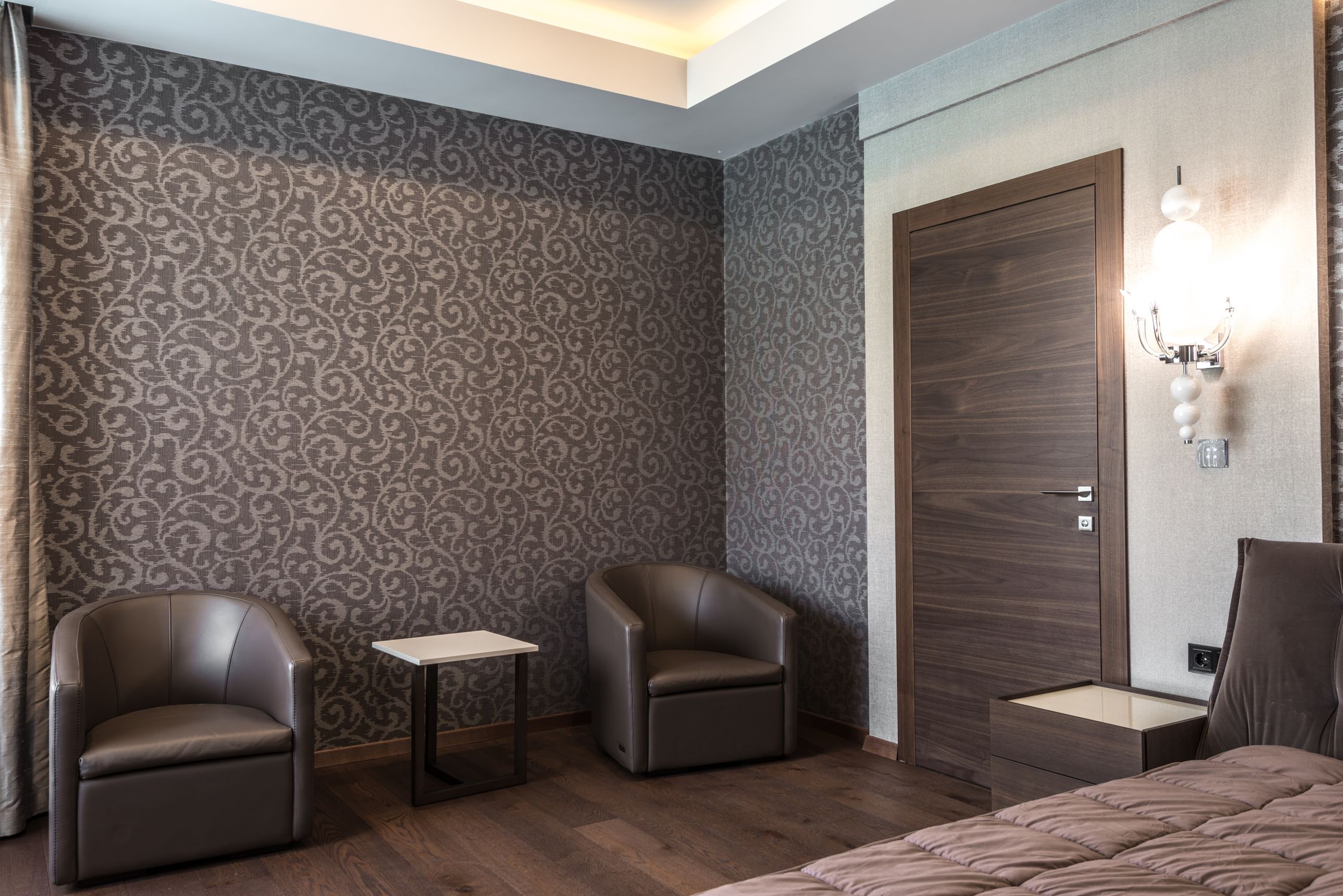 Luxurious hotel room featuring modern furniture and stylish decor.