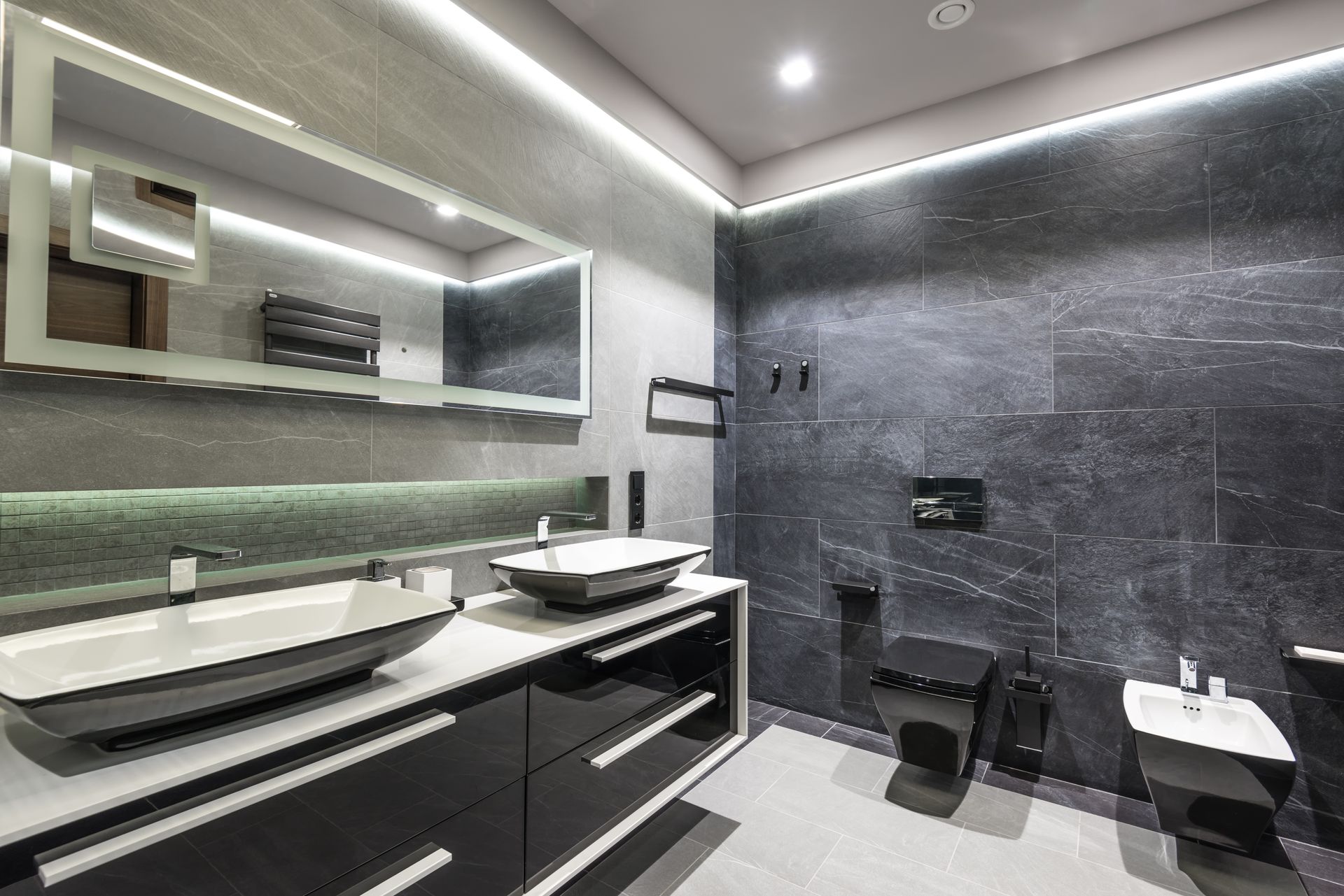 Luxurious modern bathroom with double sinks and sleek black fixtures.