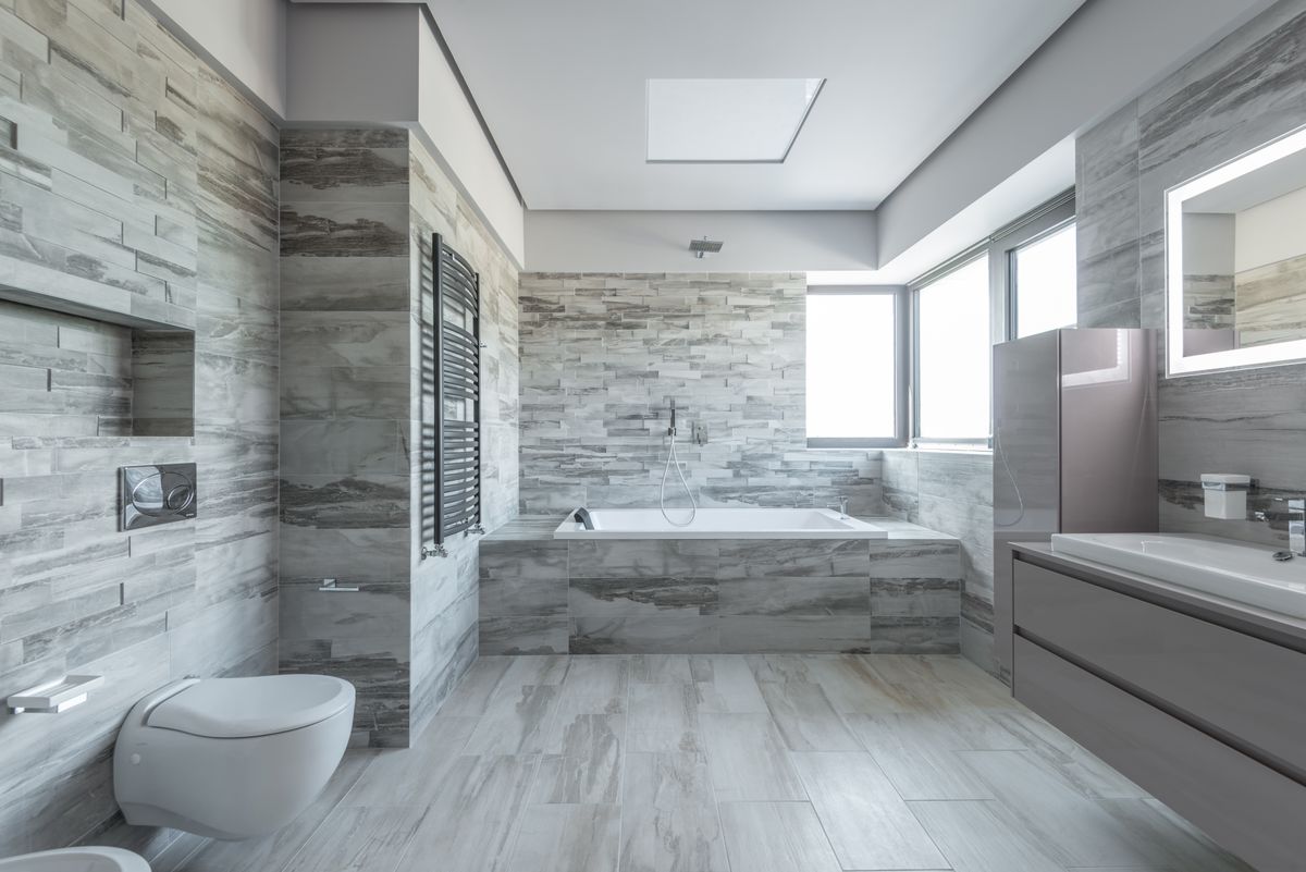 compact wet room with glass shower screen and wall hung toilet