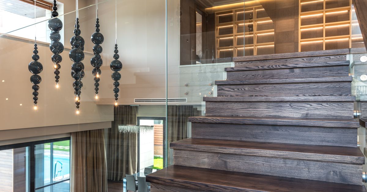 Wooden staircase with glass railing