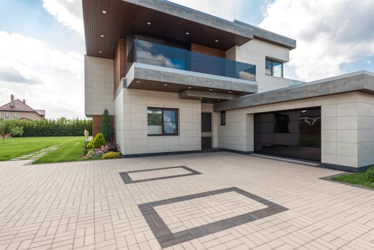 A stylish modern minimalist house exterior with clean lines and geometric shapes.