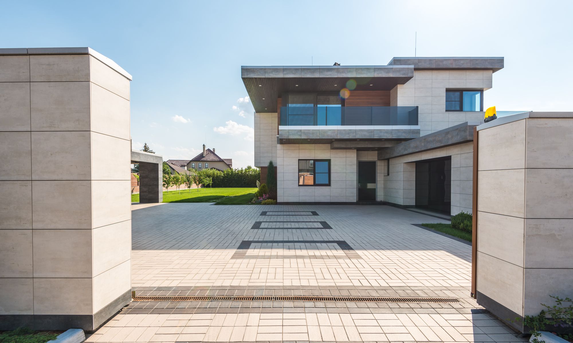 Modern luxury home exterior with premium siding and landscaped driveway