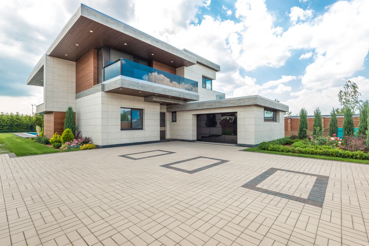 Home exterior with a spotless driveway, ready for listing photos