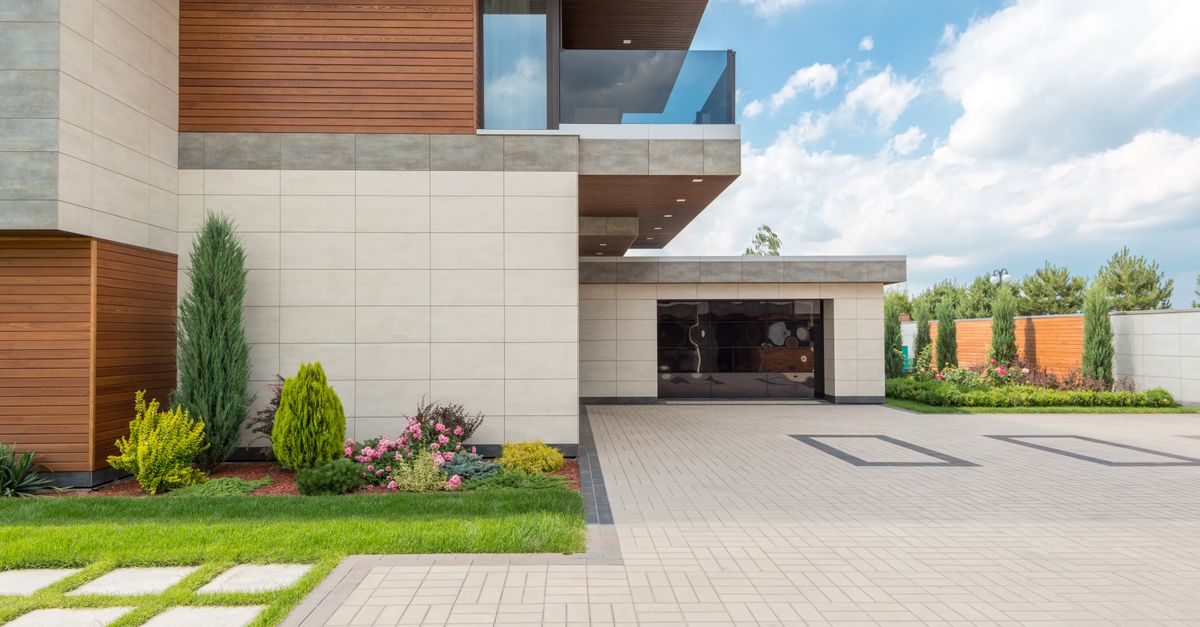 a large modern dream house with a landscaped yard