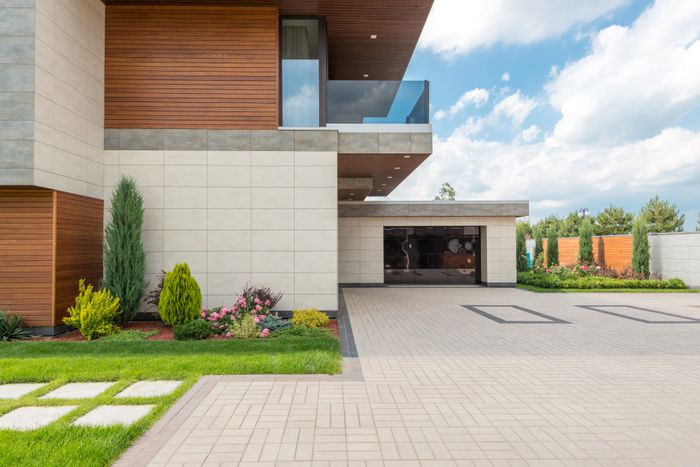 Paved driveway with landscaped garden