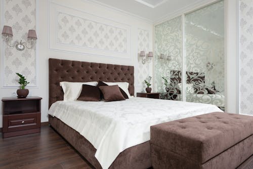 A Bedroom with Ornate Designs on the Walls