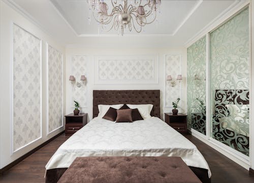 Bed and Chandelier in Bedroom