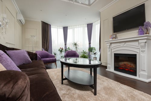 A Cozy Couch and Center Table Near the Fireplace