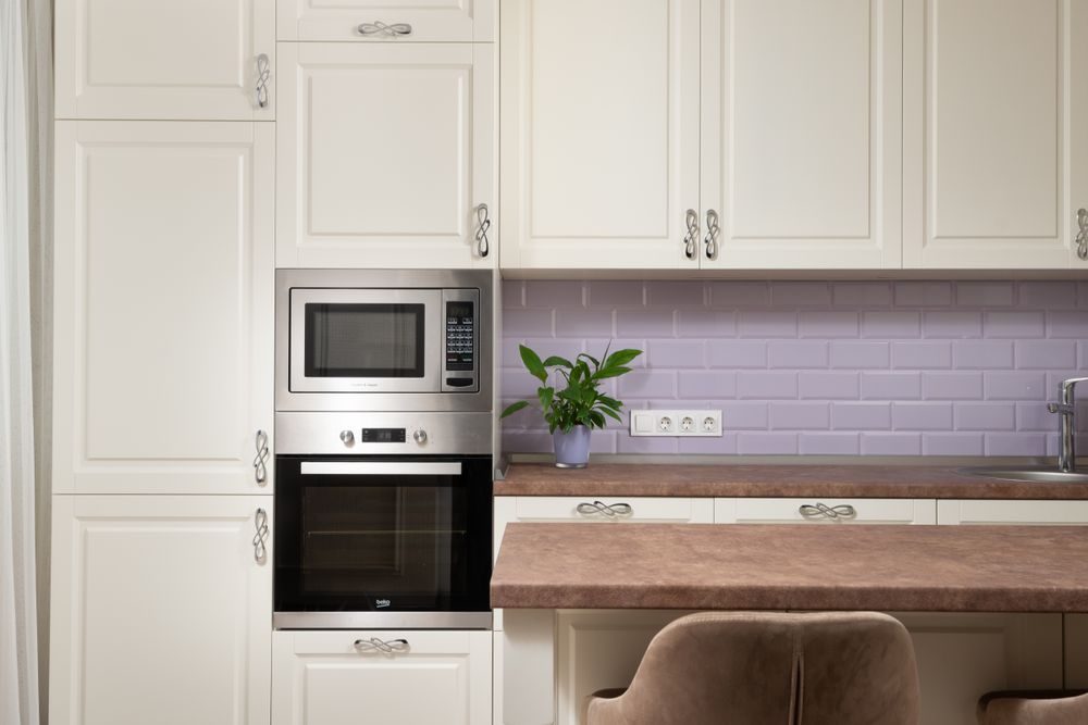 Stylish modern kitchen with cabinetry and backsplash