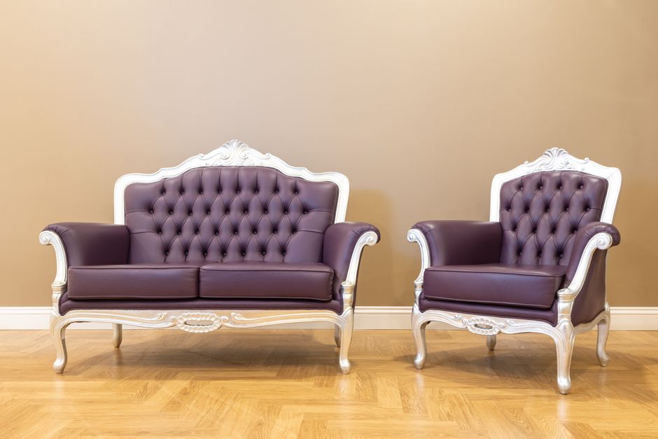 two people sitting armchairs conversation therapy room
