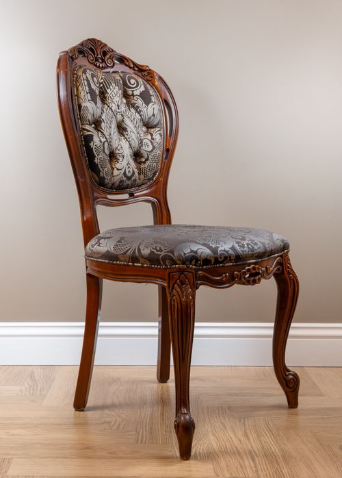 Free Vintage wooden chair with ornate fabric, perfect for classic interiors. Stock Photo