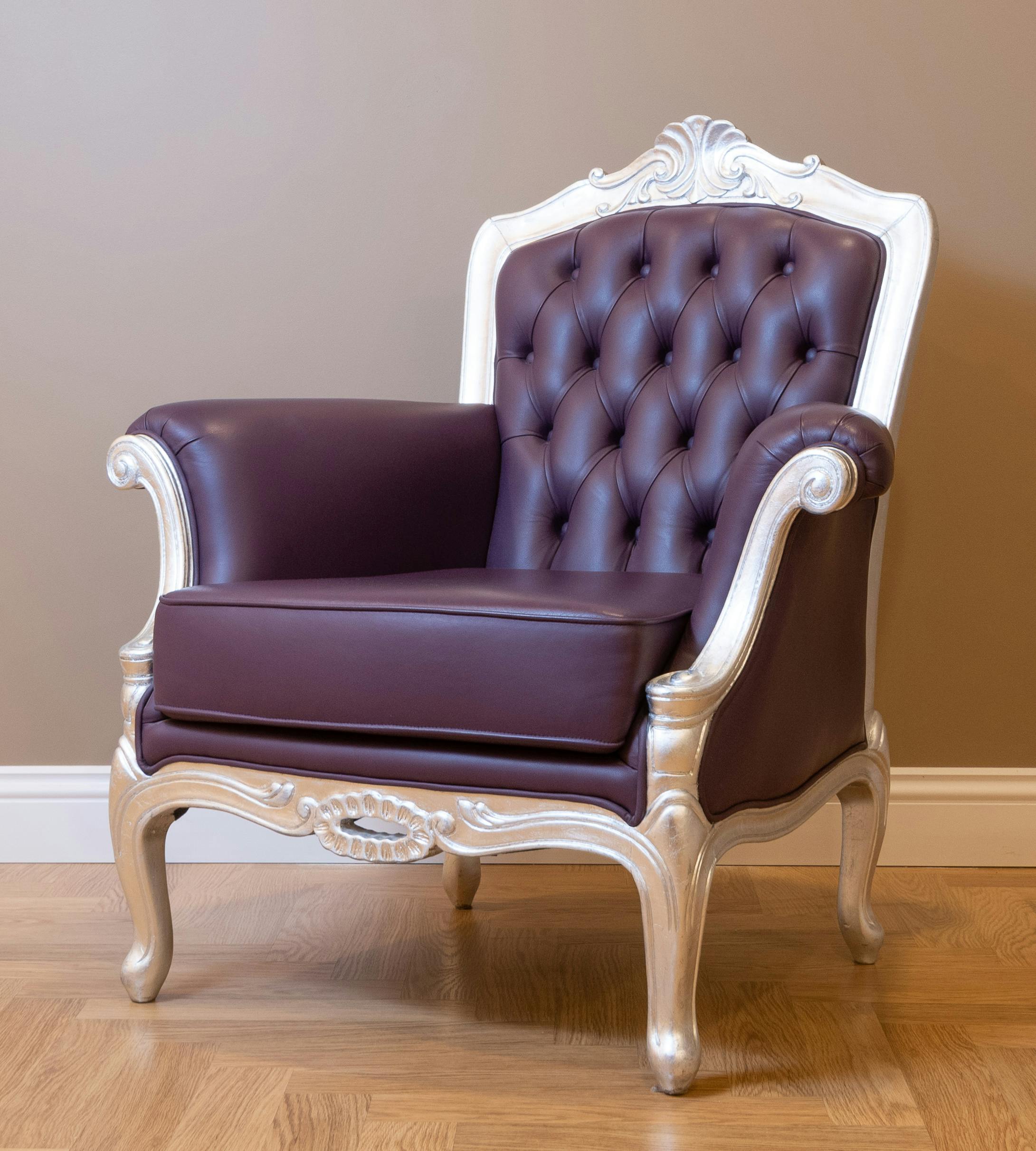 white armchair with brown leather upholstery