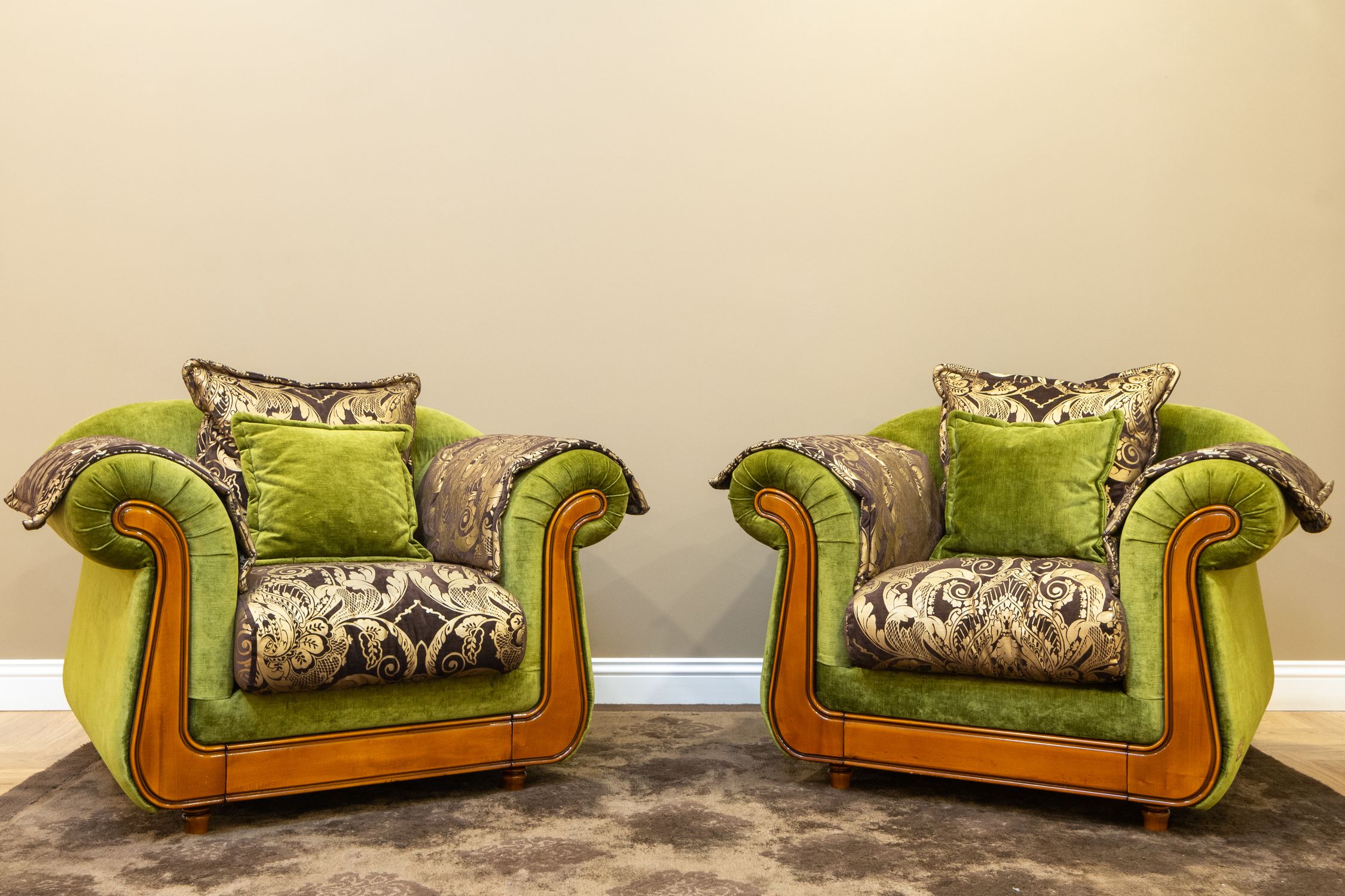 Pair of green velvet armchairs after reupholstery