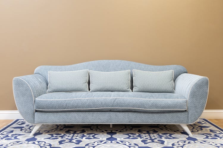 A Blue Sofa With Cushions