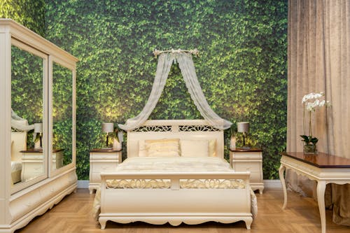 White Wooden Bed near Green Wall