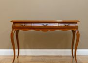 Brown Wooden Table Beside White Wall