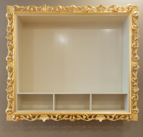 A Shelf with an Ornate Frame