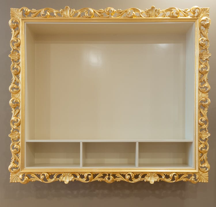 A Shelf With An Ornate Frame