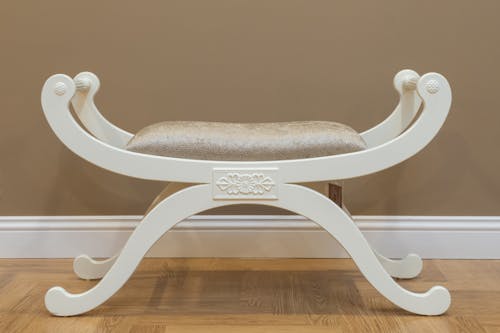 A White Wooden Chair with Cushion