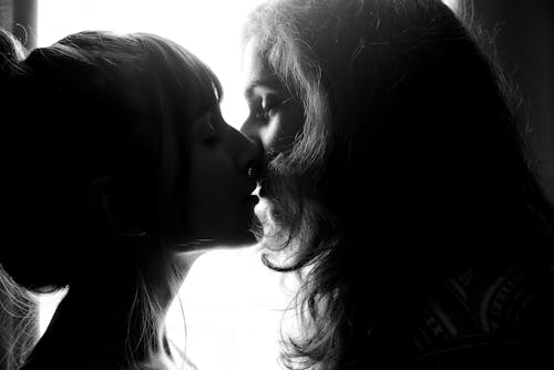 Grayscale Photography of Two Woman Kissing