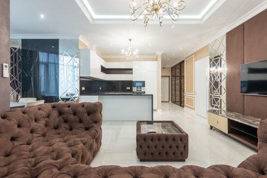 Stylish interior of a modern living room featuring plush furniture and elegant lighting.