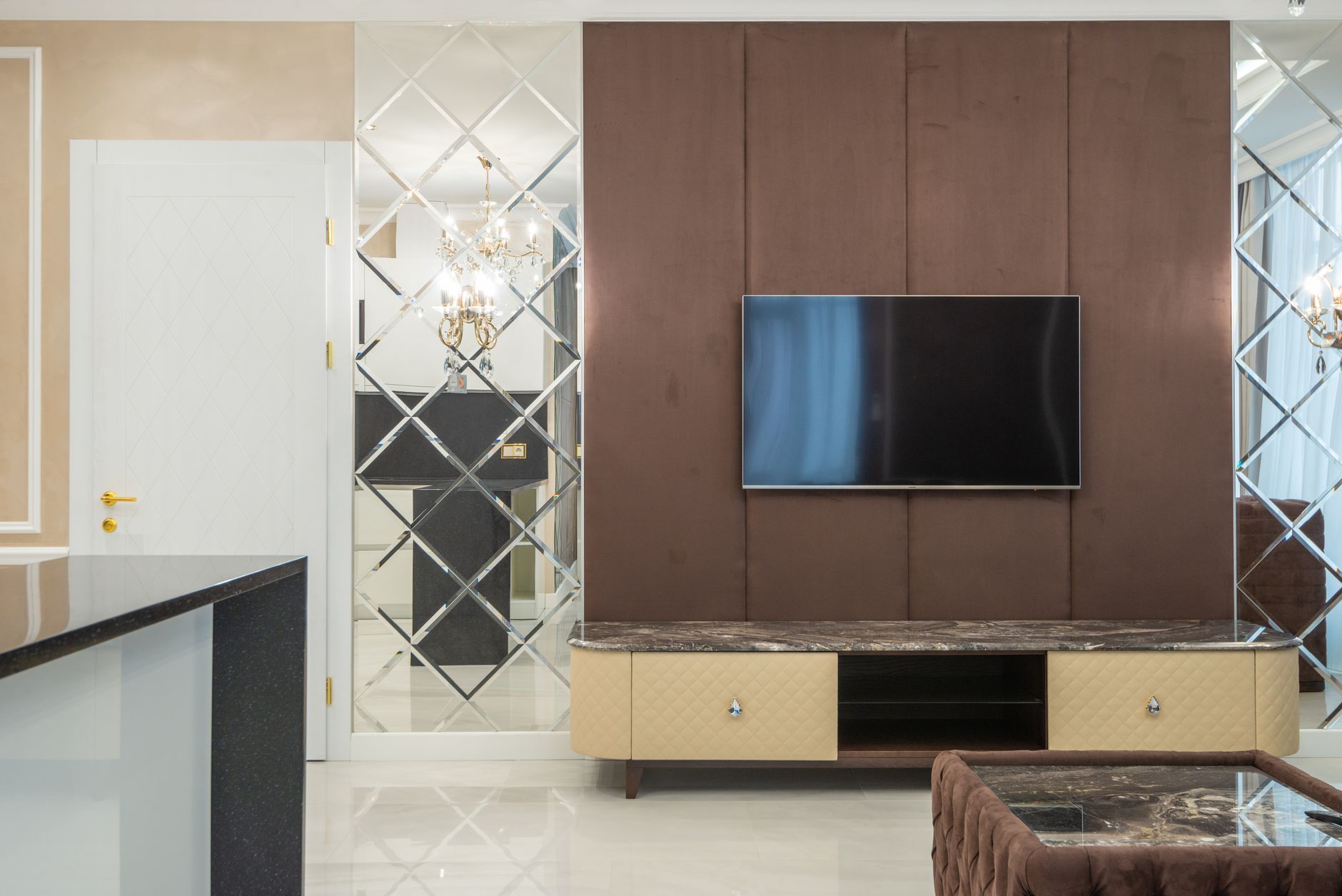 quiet luxury garage decor that look expensive Sophisticated living room featuring elegant TV wall with stylish furniture.