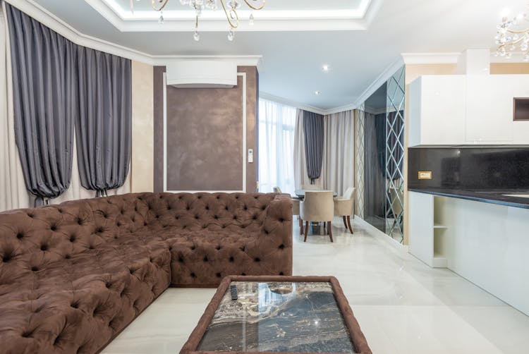 Empty Old Fashioned Style Interior With Brown Sofa And Gray Curtains