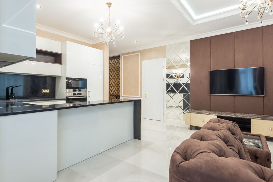 Bright and modern open plan kitchen with sleek design and minimalistic decor.