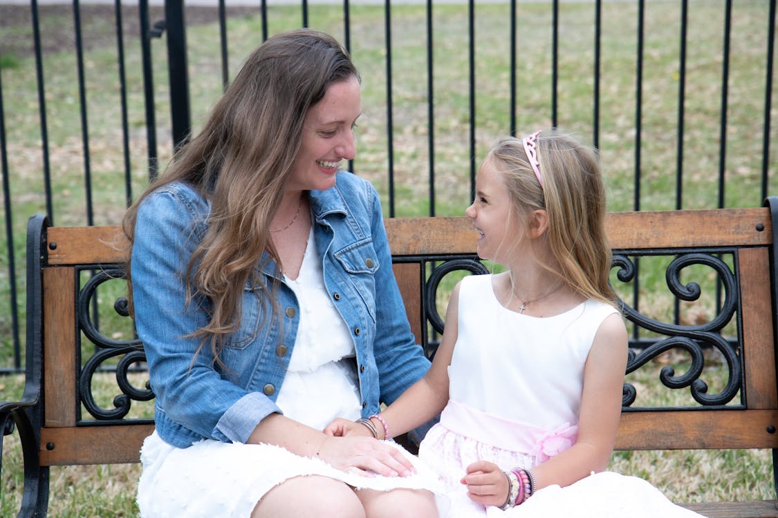 Free Photo of a Mother and Her Daughter Laughing Together Stock Photo