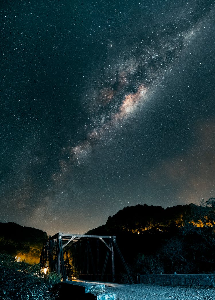 White Wooden Bridge Under Starry Night