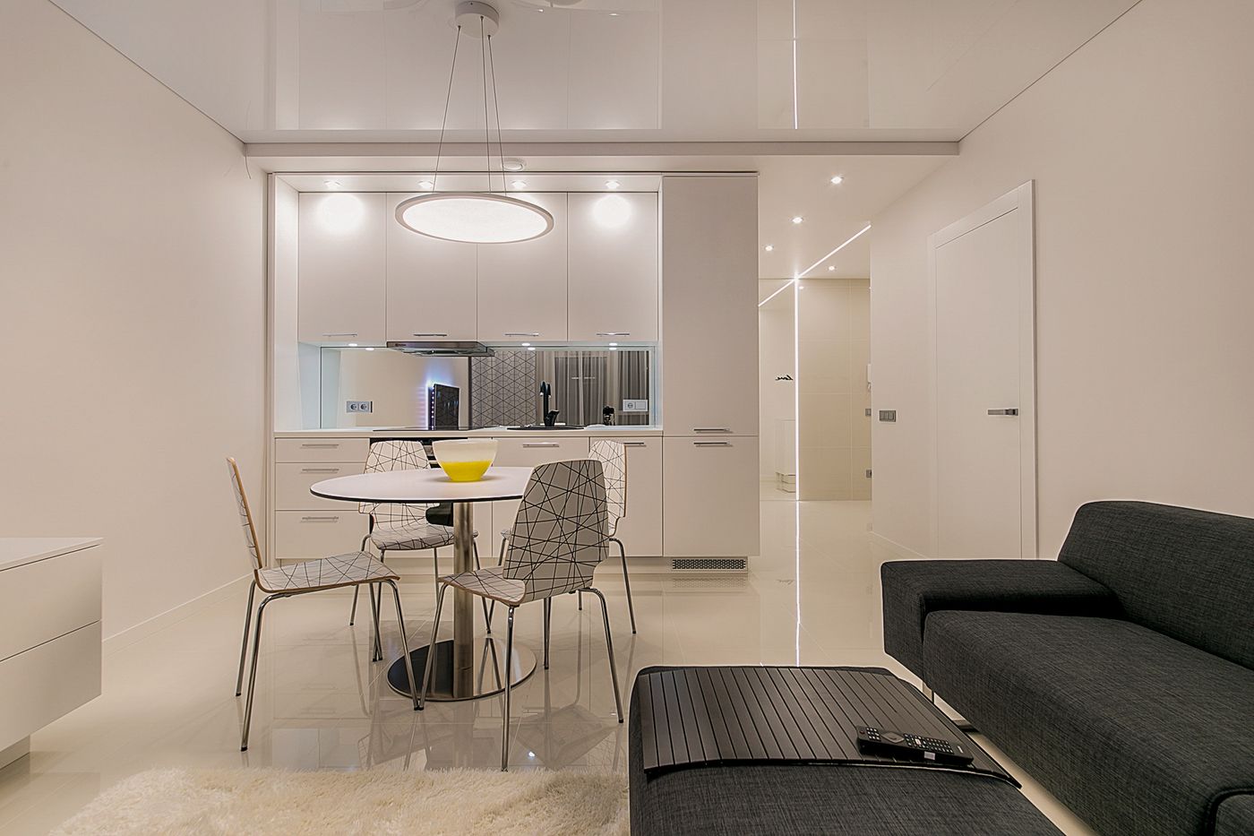 High-sheen timber furniture in raking light