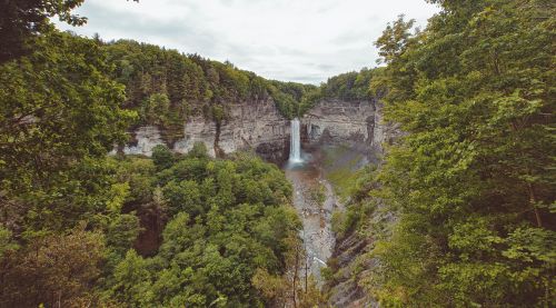 Free Breathtaking view of Taughannock Falls surrounded by lush greenery and cliffs. Stock Photo