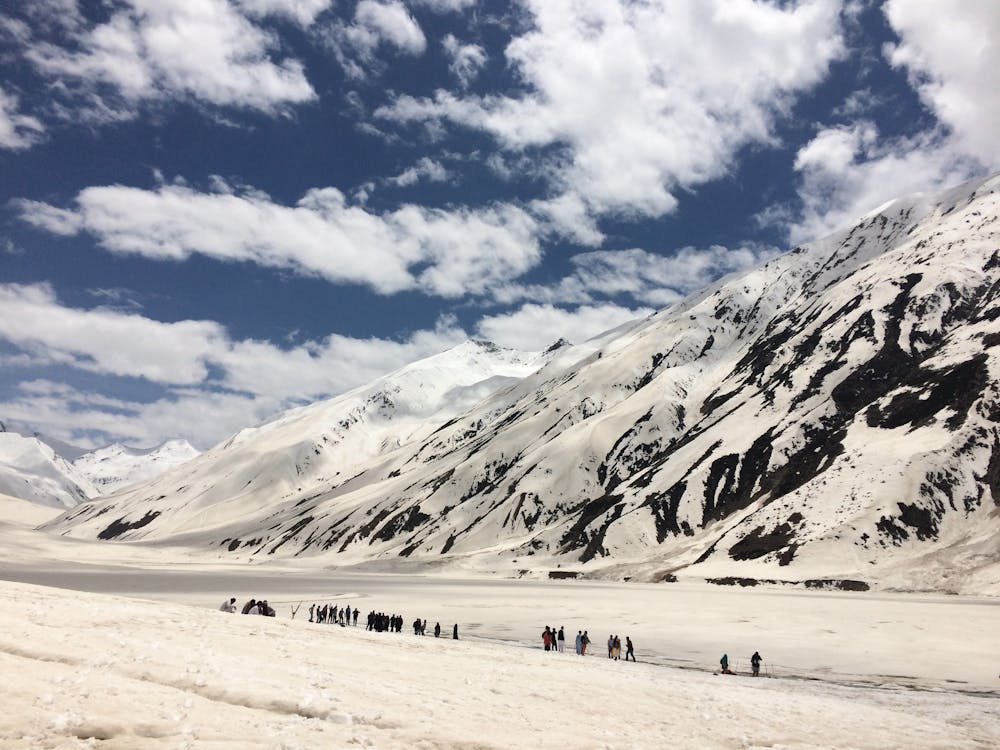 Snow-covered Mountain Under Cloudy Sky