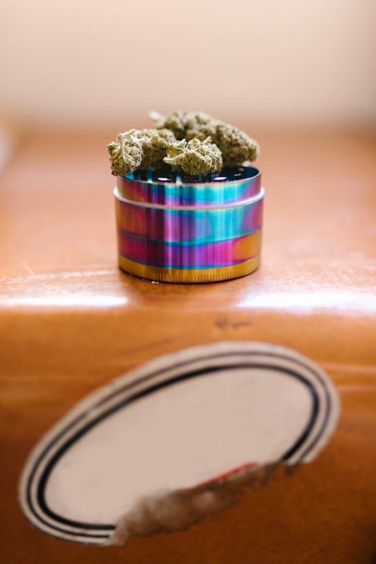 Cannabis Buds On Top Of A Grinder