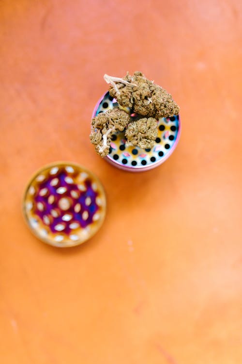Cannabis and Grinder on a Table 