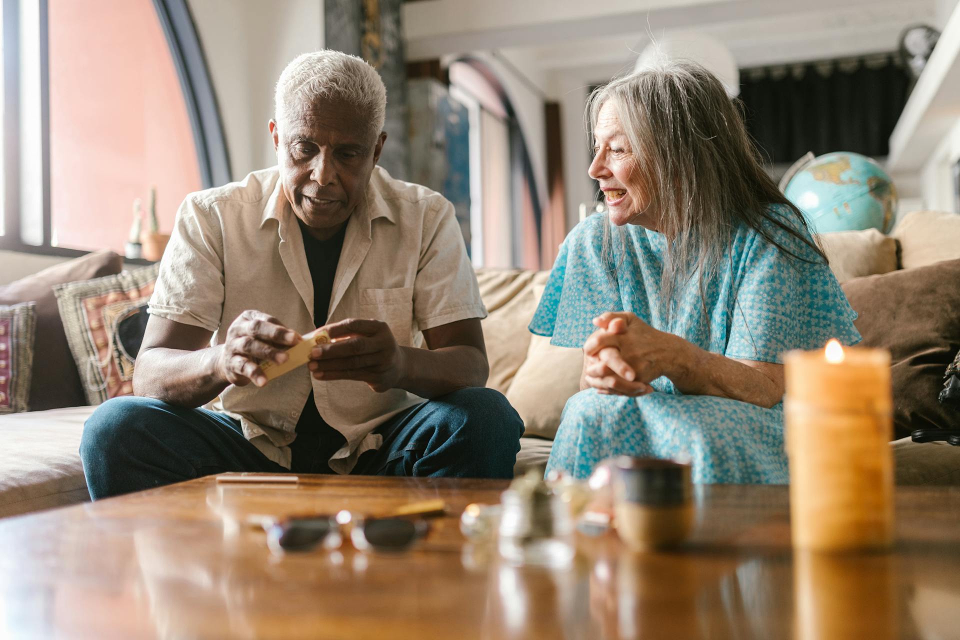 Senior couple enjoying a calm afternoon indoors with relaxing activities.