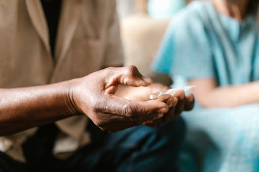 A detailed image showing a hand holding a rolling paper, emphasizing texture and focus.