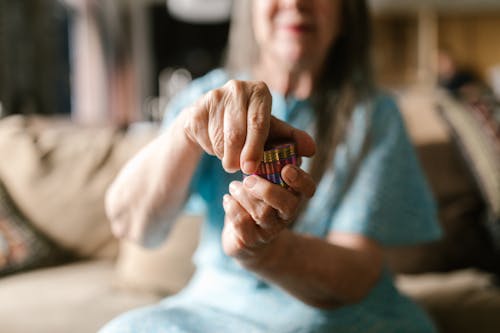 A Woman Holding a Round Container