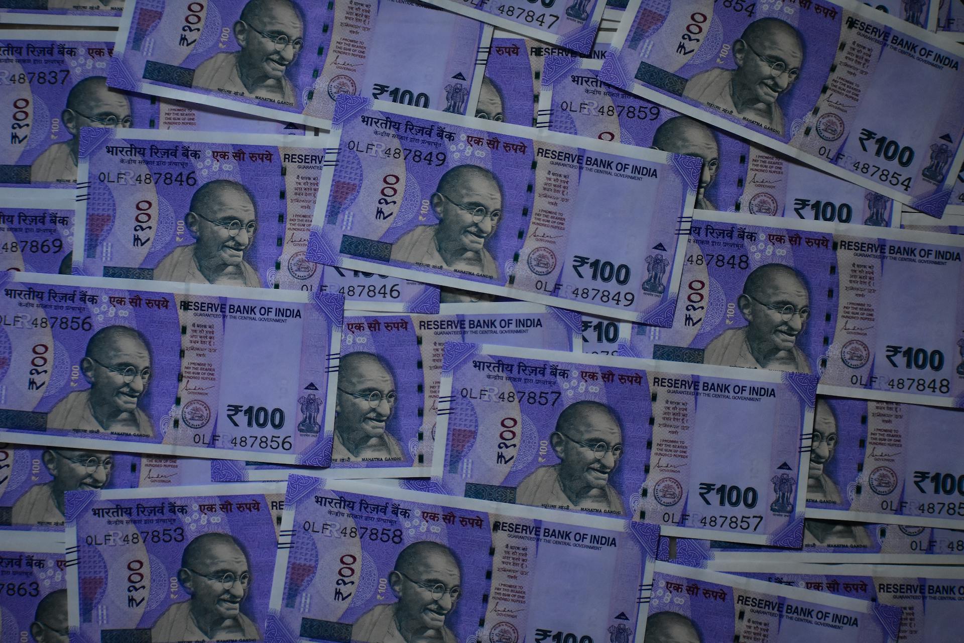 Close-up image of Indian Rupee banknotes in Kolkata, India showcasing currency design details.