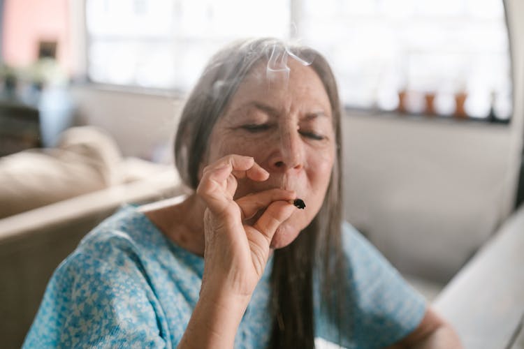 Elderly Woman Smoking Blunt