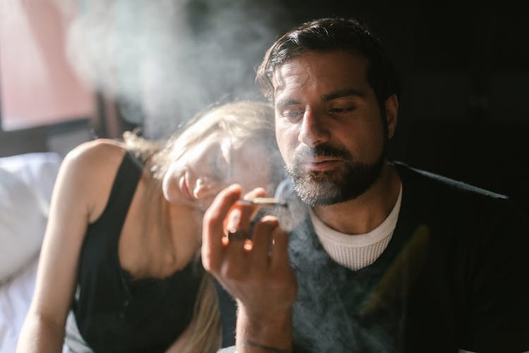 Man And Woman Smoking