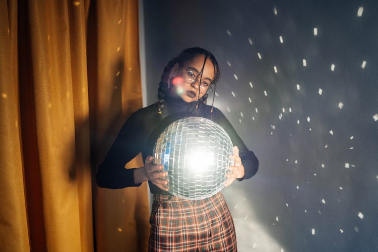 Woman Holding Disco Ball