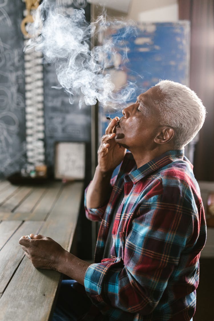 Elderly Man Smoking Marijuana Joint