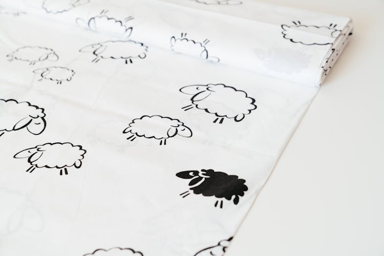 Close-up Of A Fabric With Cute Sheep Print 