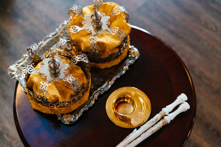 Two Golden Liturgy Crowns On A Round Table