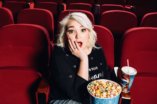 A Surprised Woman in a Movie Theater