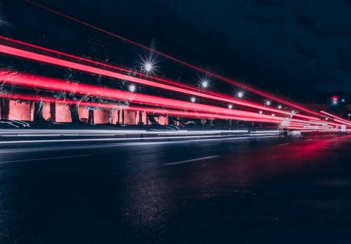 Free Long exposure captures vibrant streetlights and moving traffic in Rabat at night. Stock Photo