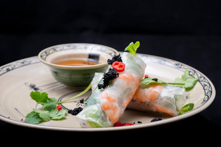 Close-Up Shot Of Vietnamese Spring Rolls On Ceramic Plate