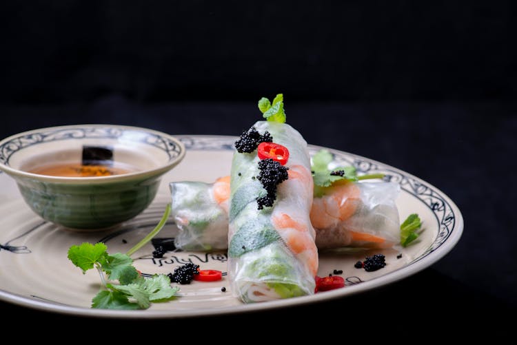 Close-Up Shot Of Vietnamese Spring Rolls On Ceramic Plate