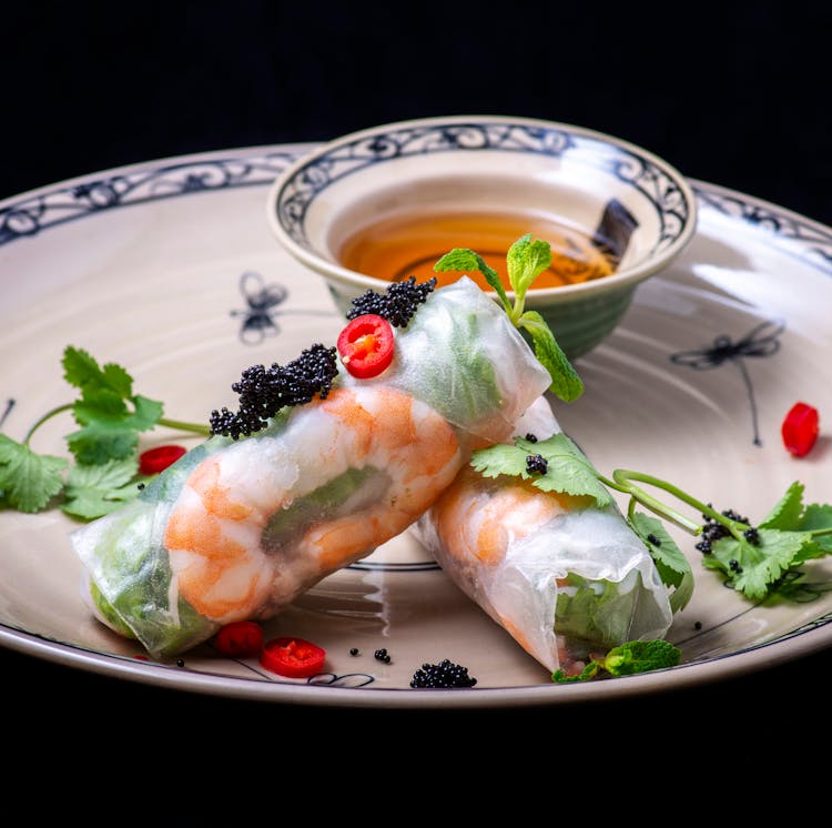 Close-Up Shot Of Vietnamese Spring Rolls On Ceramic Plate